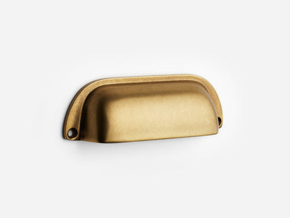 Solid brass Dane bin pull, 4 inches, in an aged brass finish for cabinets.