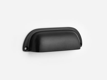 Solid brass Dane bin pull, 4 inches, in a matte black finish for cabinets.