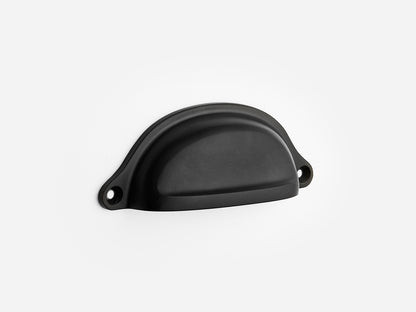 Solid brass Liberty bin pull, 4 inches, in a matte black finish for cabinets.
