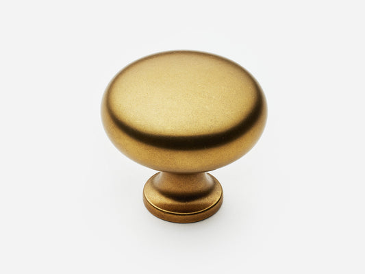 Solid brass Classic Knob, large size, in an aged brass finish for cabinets.
