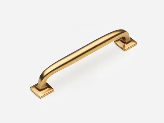 Solid brass Dapper drawer pull, 6 inches, in an aged brass finish for cabinets.