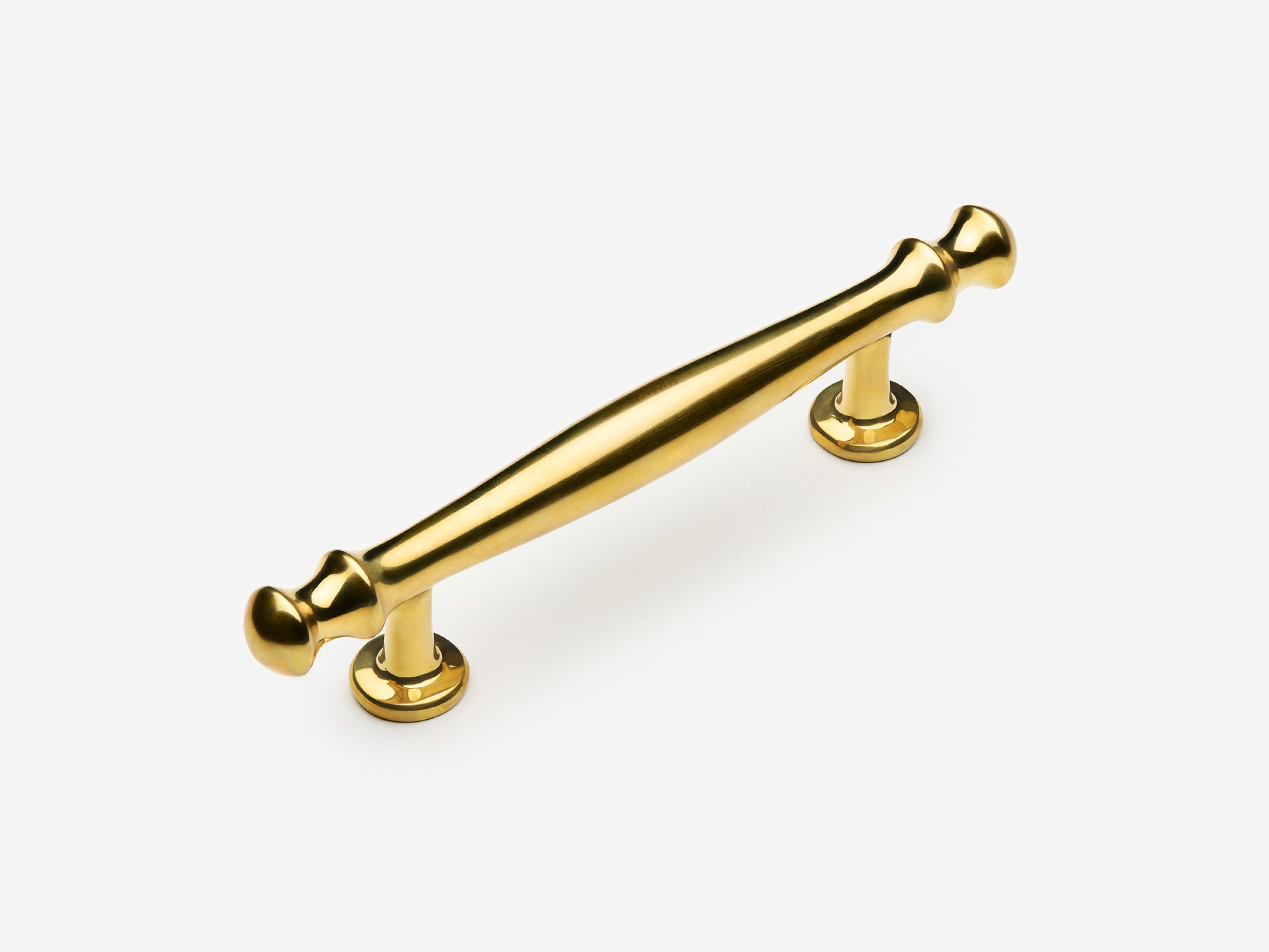 Solid brass Helena drawer pull, 4 inches, in an unlacquered polished brass finish for cabinets.
