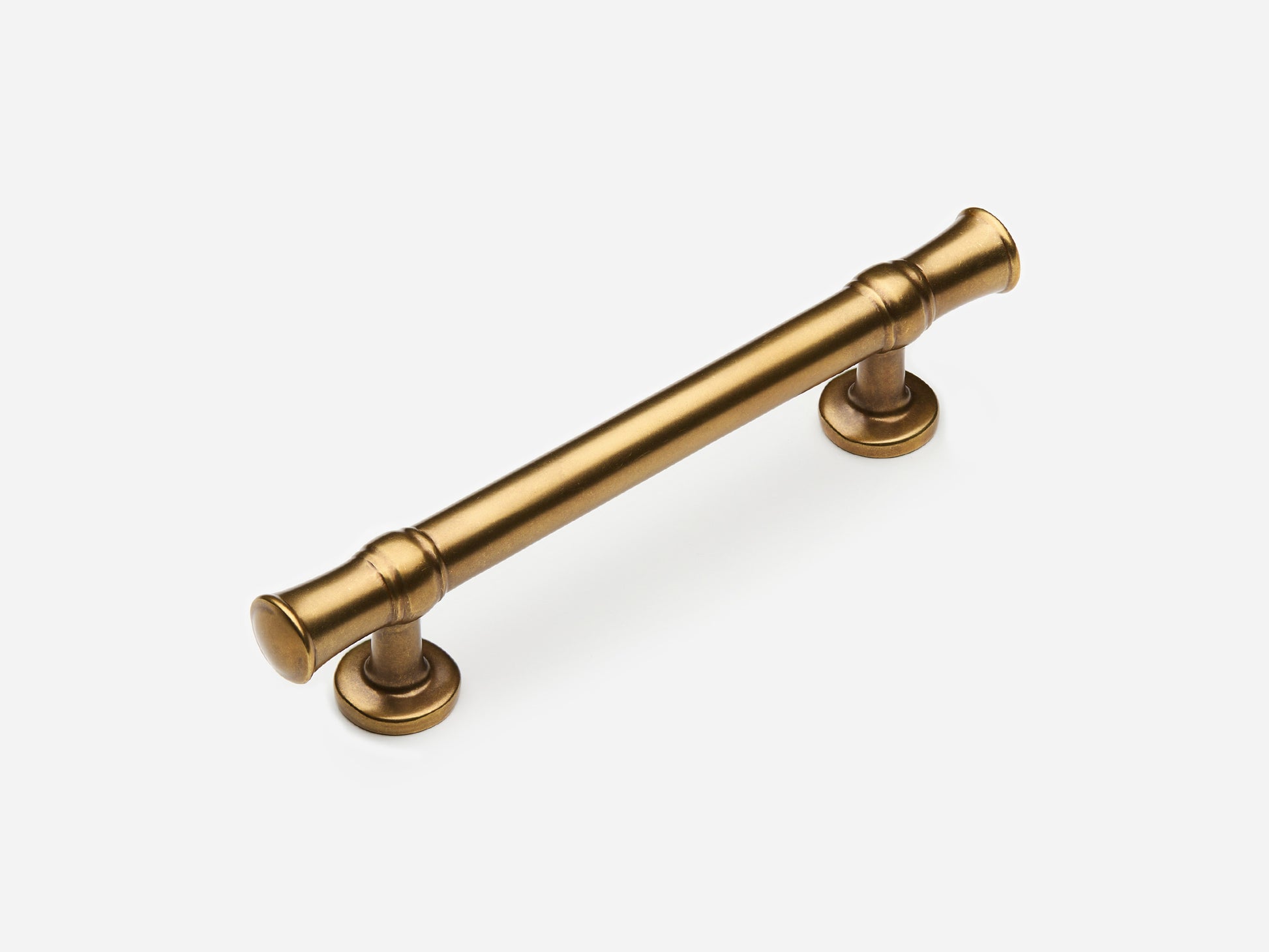 Solid brass Heritage drawer pull, 4 inches, in an aged brass finish for cabinets.