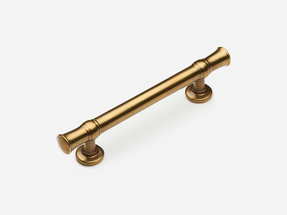 Solid brass Heritage drawer pull, 4 inches, in an aged brass finish for cabinets.
