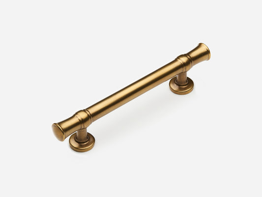 Solid brass Heritage drawer pull, 4 inches, in an aged brass finish for cabinets.