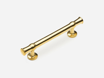 Solid brass Heritage drawer pull, 4 inches, in an unlacquered polished brass finish for cabinets.