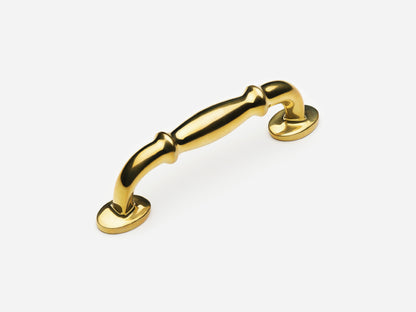 Solid brass Lilian drawer pull, 4 inches, in an unlacquered polished brass finish for cabinets.