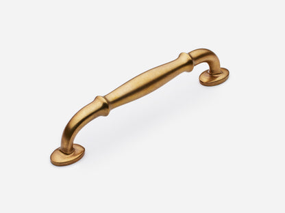 Solid brass Lilian drawer pull, 6 inches, in an aged brass finish for cabinets.