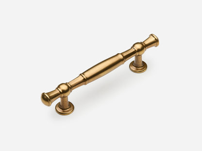 Solid brass Windsor drawer pull, 4 inches, in an aged brass finish for cabinets.