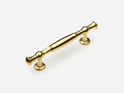 Solid brass Windsor drawer pull, 4 inches, in an unlacquered polished brass finish for cabinets.