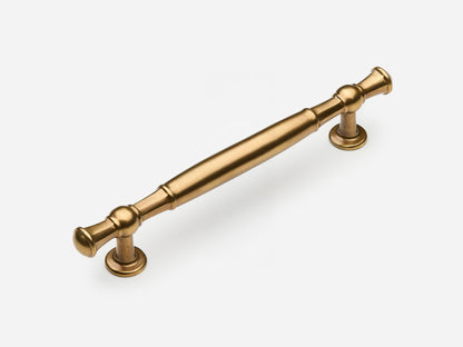 Solid brass Windsor drawer pull, 6 inches, in an aged brass finish for cabinets.
