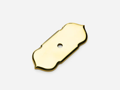 Solid brass France backplate, 1x2.5 inches, in an unlacquered polished brass finish for knobs on cabinets.