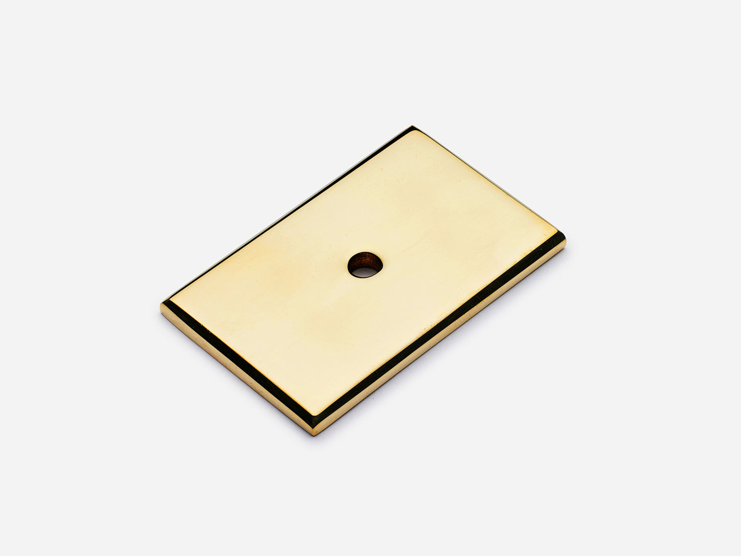 Solid brass rectangular backplate, 1.25x2 inches, unlacquered polished brass finish for knobs and pulls on cabinets.