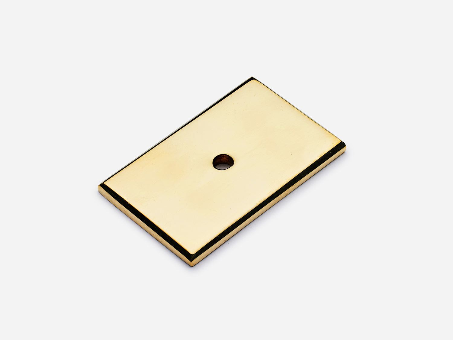 Solid brass rectangular backplate, 1.25x2 inches, unlacquered polished brass finish for knobs and pulls on cabinets.