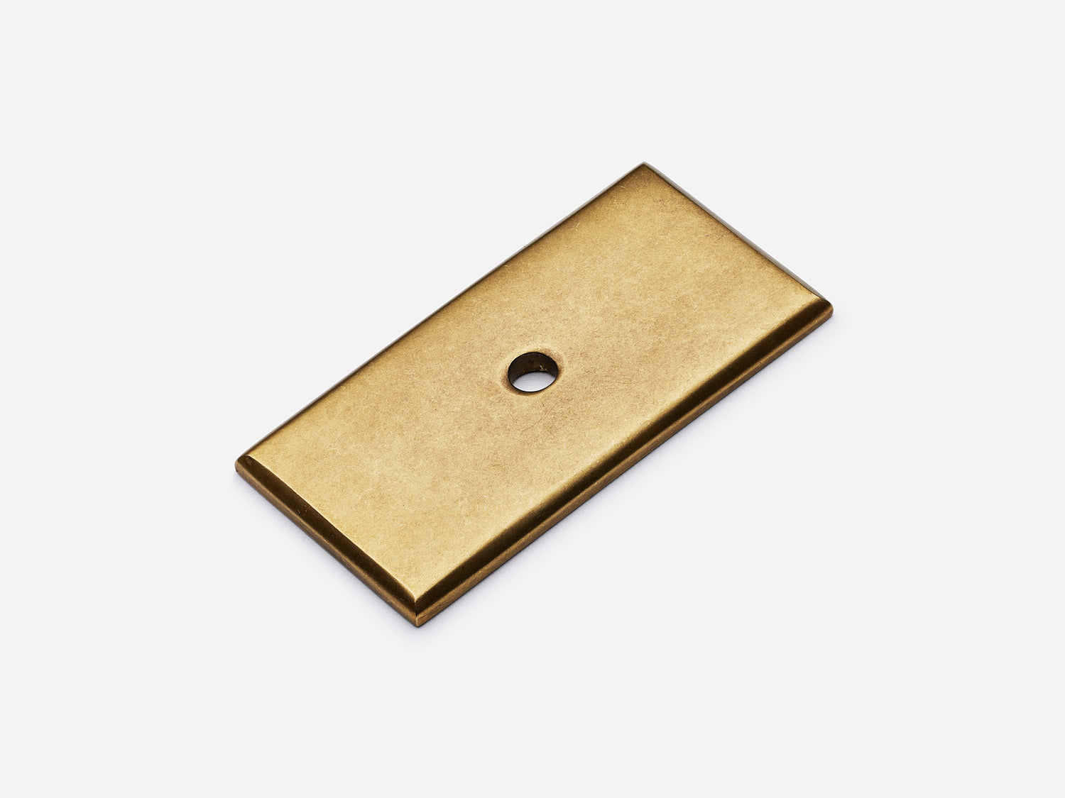 Solid brass rectangular backplate, 1x2 inches, aged brass finish for knobs and pulls on cabinets.