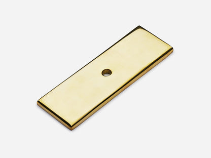 Solid brass rectangular backplate, 1x3 inches, unlacquered polished brass finish for knobs and pulls on cabinets.