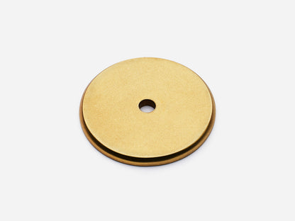 Solid brass Round backplate, 1.5 inches, in an aged brass finish for knobs on cabinets.