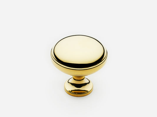 Solid brass Royal Knob, standard size, in an unlacquered polished brass finish for cabinets.