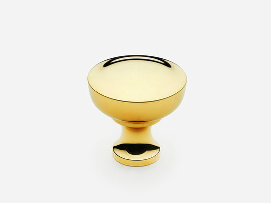 Solid brass Triumph Knob, standard size, in an unlacquered polished brass finish for cabinets.
