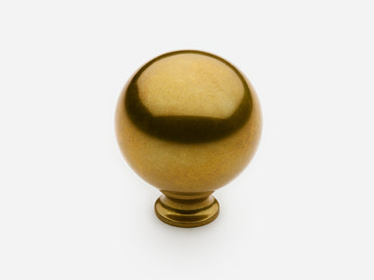 Solid brass Ball Knob, large size, in an unlacquered aged brass finish for cabinets.