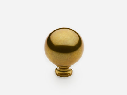 Solid brass Ball Knob, standard size, in an unlacquered aged brass finish for cabinets.