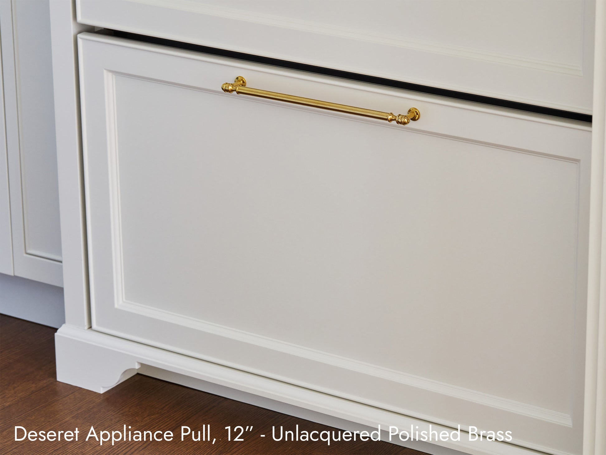 Solid brass Deseret Appliance Pull, in unlacquered polished brass, on kitchen cabinets.