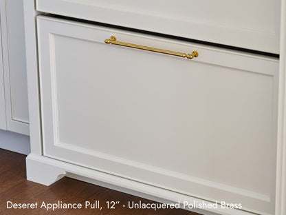 Solid brass Deseret Appliance Pull, in unlacquered polished brass, on kitchen cabinets.