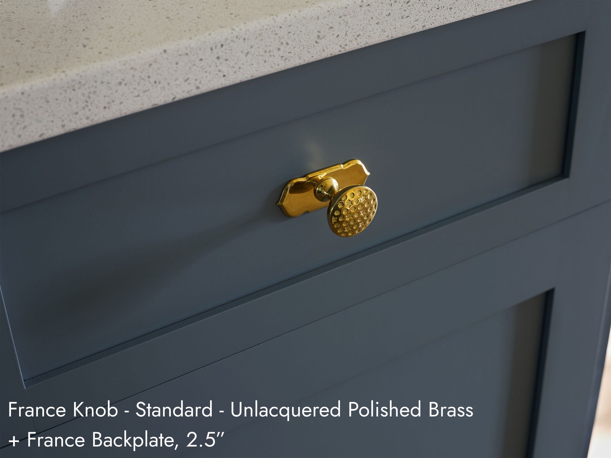 Solid brass France Knob, in unlacquered polished brass finish, on kitchen cabinets with France Backplate.
