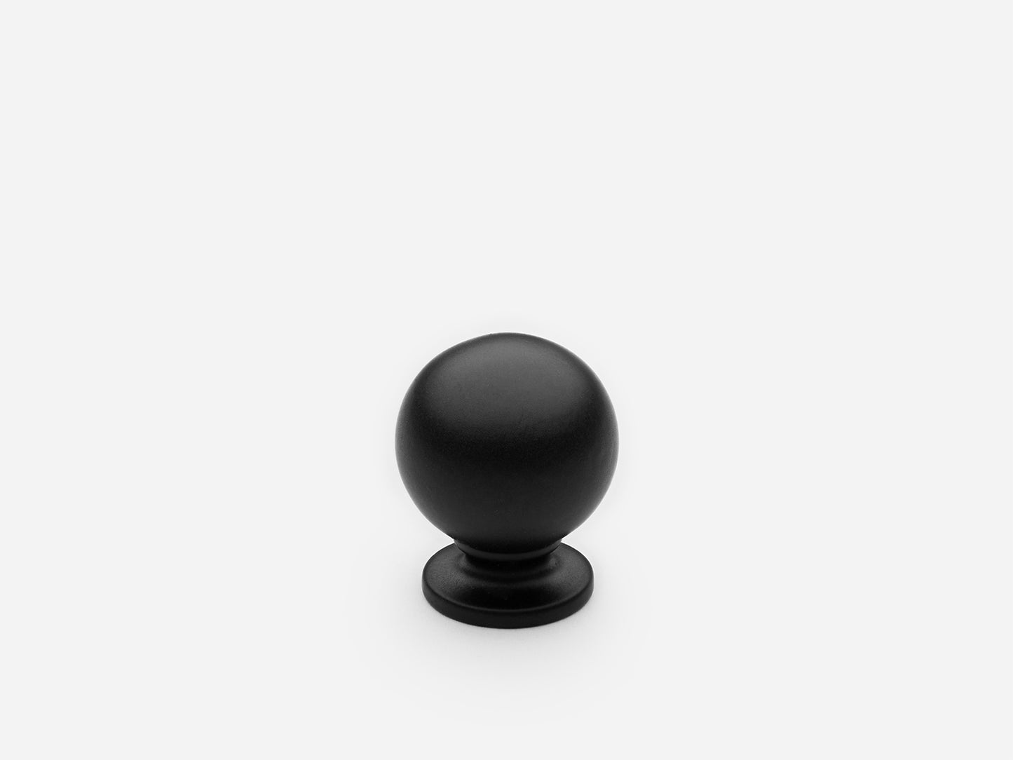 Solid brass Luxe Ball Knob, extra small size, in a matte black finish for cabinets.