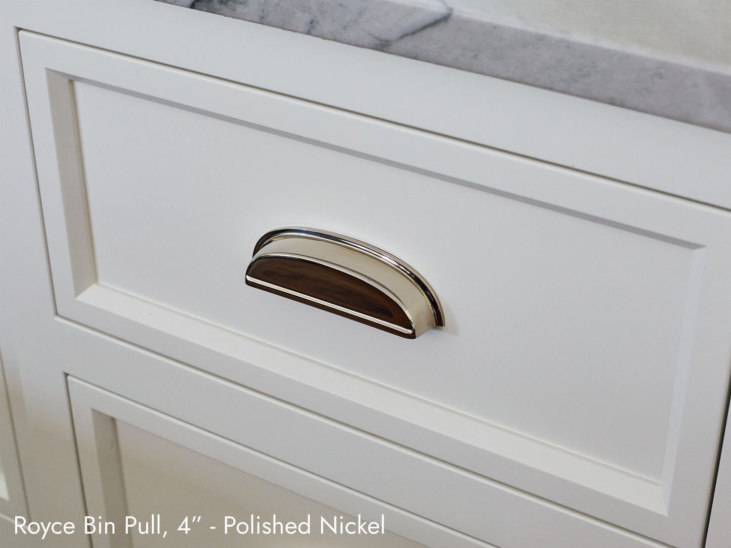 Solid brass Royce Bin Pull, in polished nickel, on kitchen cabinets.