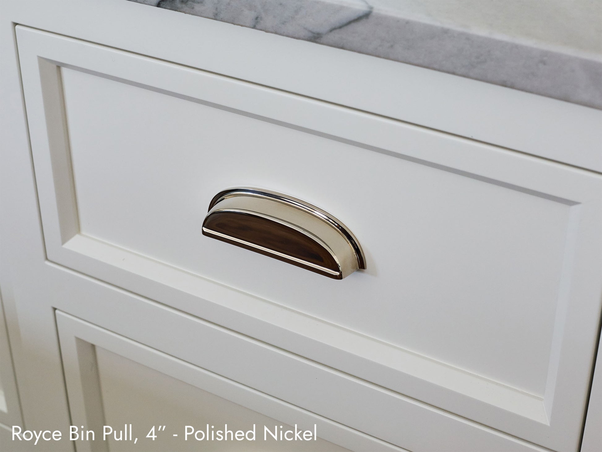 Solid brass Royce Bin Pull, in polished nickel, on kitchen cabinets.