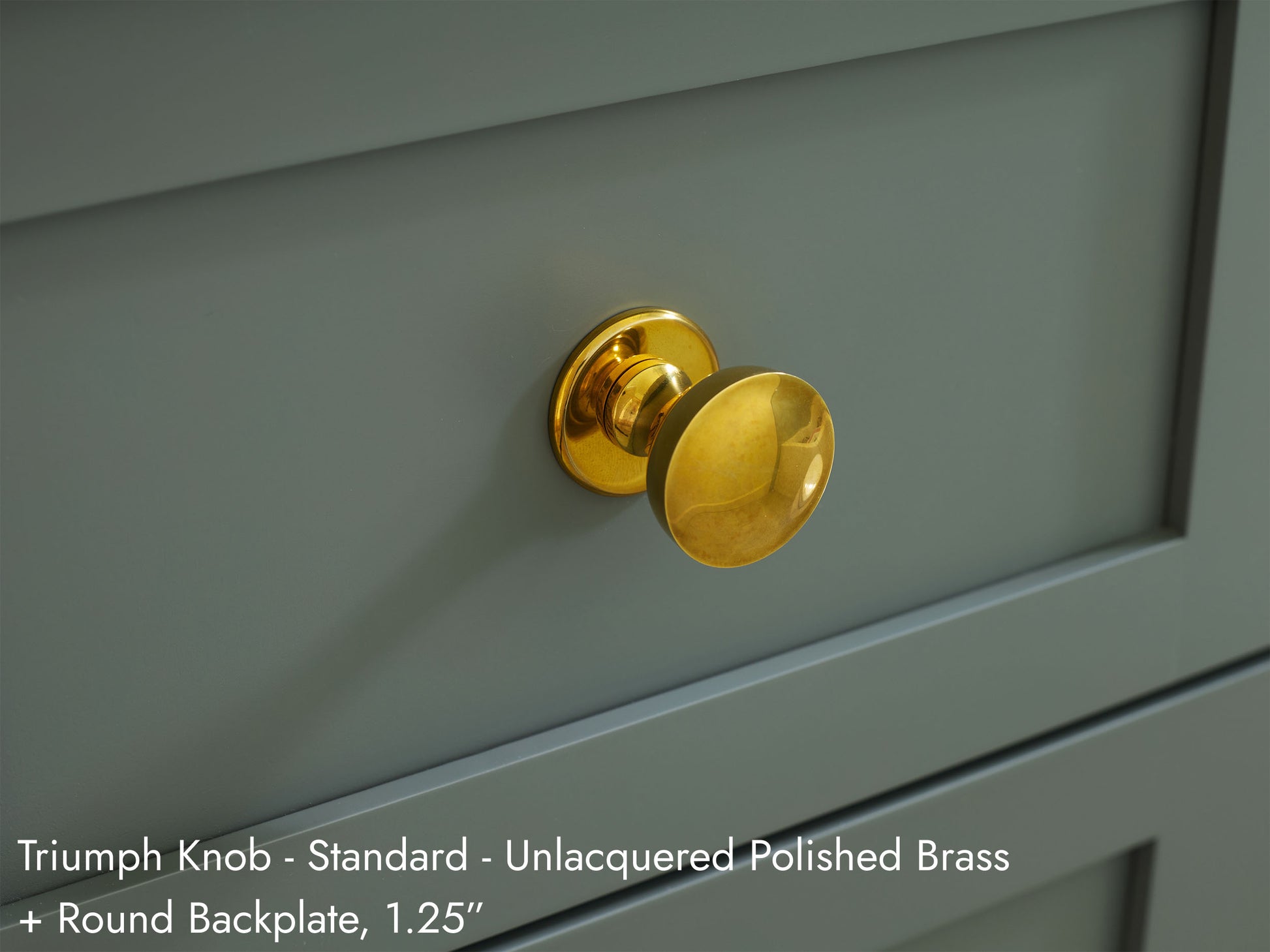 Solid brass Triumph Knob, in unlacquered polished brass finish, on kitchen cabinets with Round Backplate.