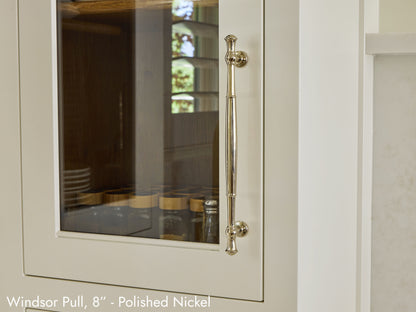 Solid brass Windsor Pull, in polished nickel finish, on kitchen cabinets.